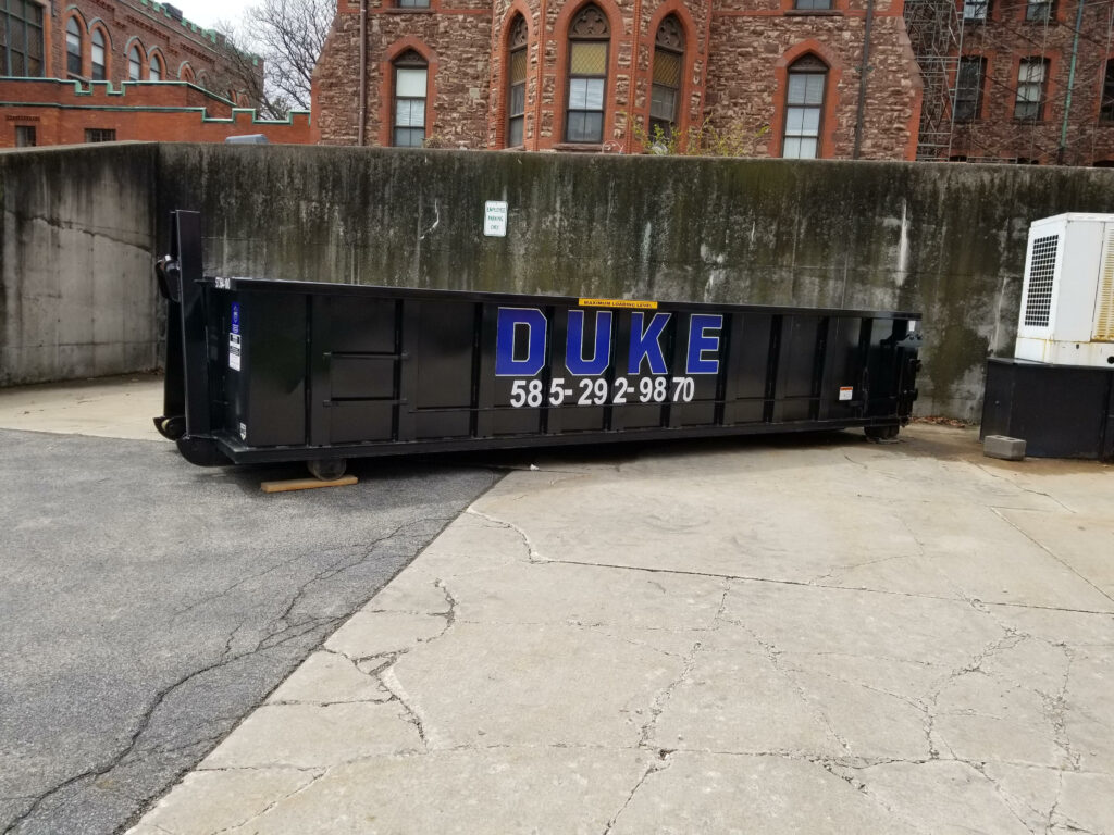 Duke Company Roll Off Dumpster for Commercial Roofing Project in Rochester